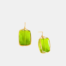 Close-up of Bisou Peridot Stud Earrings handcrafted in gold by Mare De Vetro.