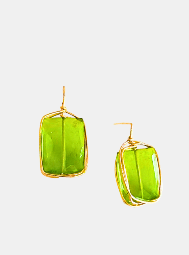 Close-up of Bisou Peridot Stud Earrings handcrafted in gold by Mare De Vetro.